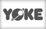 Yoke logo with a ringed planet forming the letter O