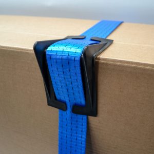 Blue webbing strap with black corner protector securing a cardboard box