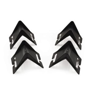 Four black plastic corner protectors arranged on a white background