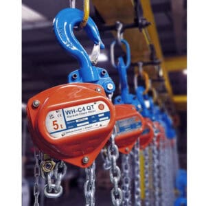 WH-C4 QT chain hoist with blue hook and orange housing hanging in a row with chains in workshop